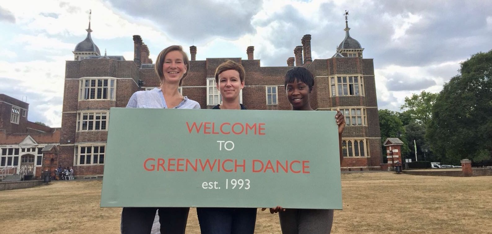 Ragnhild, Melanie and Chenube stand in front of their new home, Charlton House