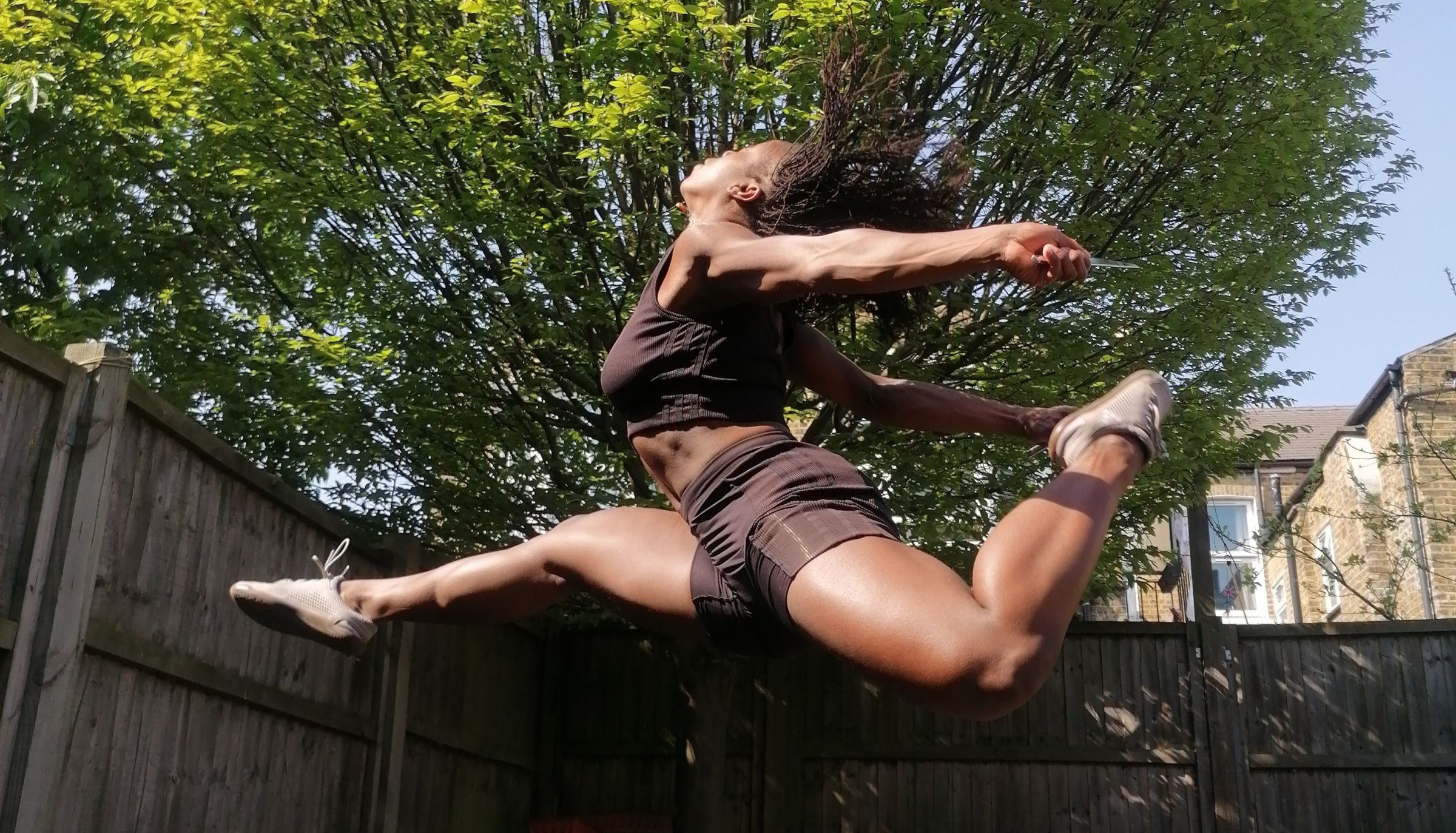 A dancer leaps through the air