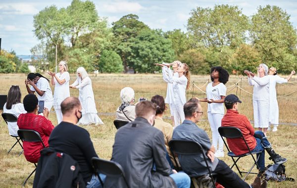 Adult Performance Company. Intergenerational performance group performing at GDIF in white clothing