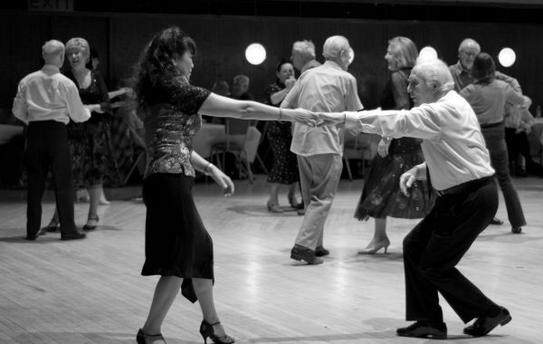 30 years in pictures: Social Dancing. A black and white photo of a couple dancing in the borough hall