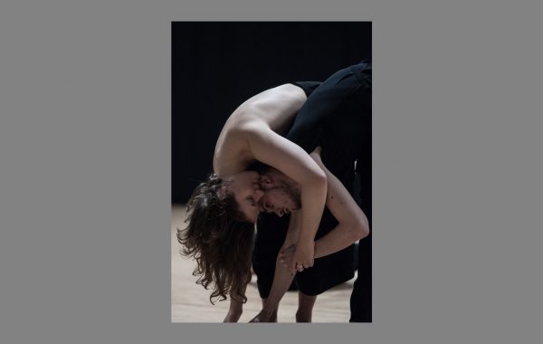 30 years in pictures: Theo Clinkard and Rachel Krische. Two dancers are bent over together, one with her arm around the other.